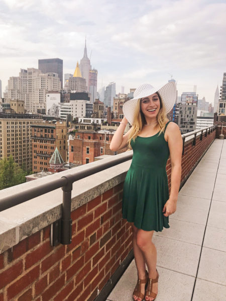 Picture of a young woman wearing a green dress and a white hat. The Skin Cancer Foundation