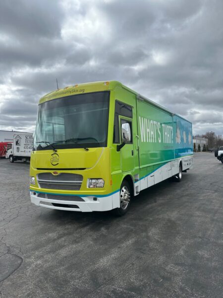 A front view of the new Destination Healthy Skin RV